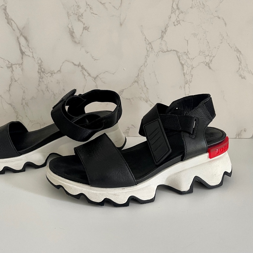 Sorel Black and White Platform Sandals with Red Accent